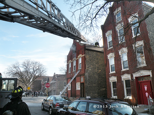 aerial ladder truck to roof of apartment building