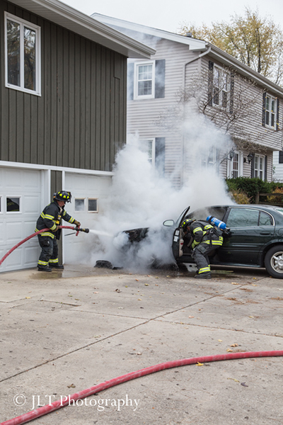 car fire in driveway