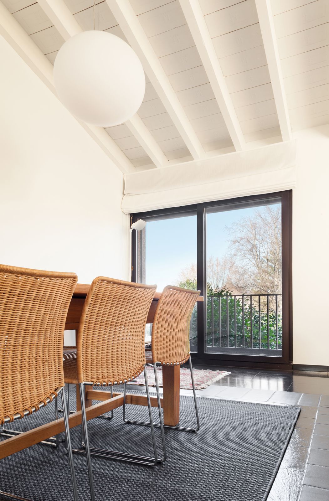 Wicker Chair Seating Arrangements for a Dining Room with Sliding Glass Doors