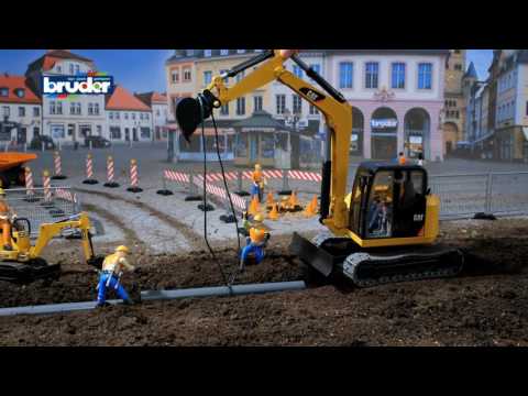 Cat Mini Excavator with Worker.