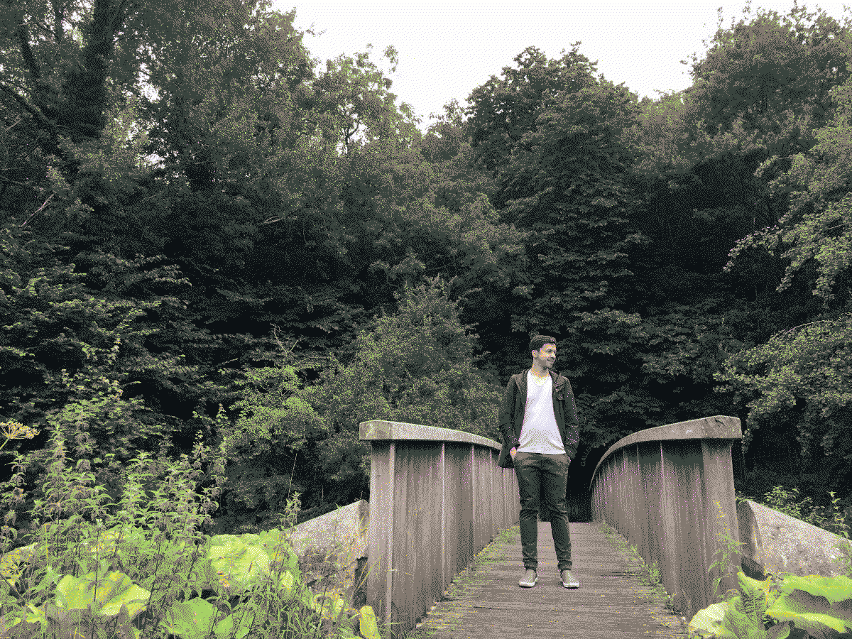 a picture of me on a bridge at Water of Leith Walkway in Edinburgh, close to steps up to Scottish National Gallery of Modern Art