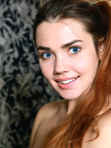 Blue-eyed gamer girl loves her blue DualShock, loves getting on