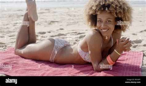 Girl In Bikini Lying At Beach Stock Photo - Alamy