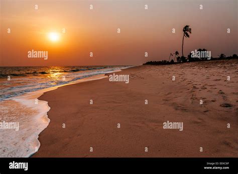 Sunset at the beach of Ada Foah, Ghana Stock Photo - Alamy