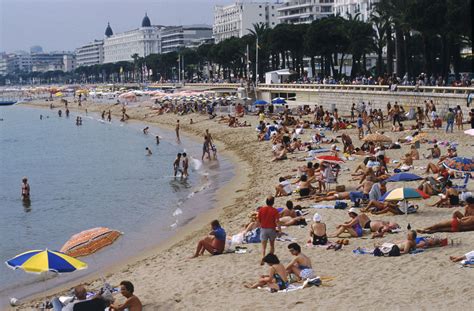 Sunny day at Cannes beach, French Riviera | French beach, French riviera, Riviera