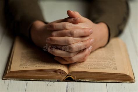 Open Bible With Praying Hands