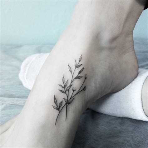 Flower tattoo on the foot - Tattoogrid.net