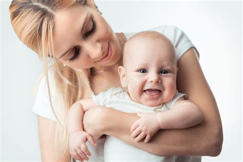 Young mother hugging baby stock image. Image of attractive - 35428581