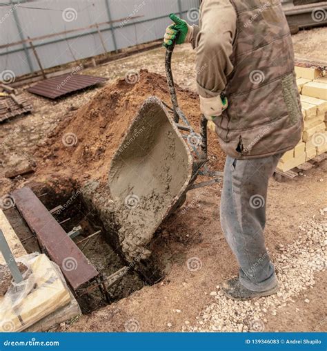 Concrete in a Wheelbarrow at a Construction Site Stock Image - Image of ...