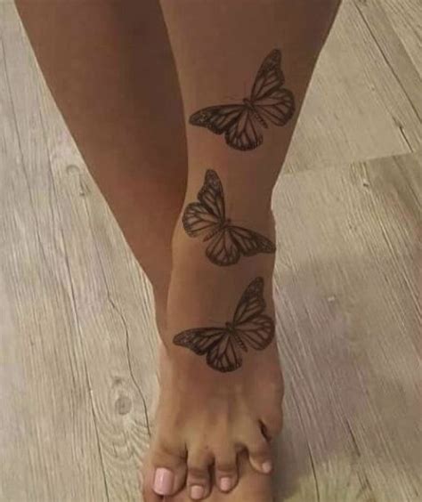 Butterflies tattoo in 2021 | Henna tattoo foot, Butterfly ankle tattoos ...