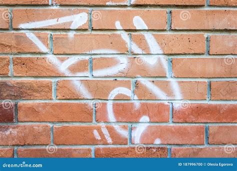 Fragment of an Old Damaged Red Brick Wall with Graffiti Marks. Texture and Background. Stock ...