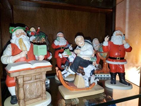 6 Norman Rockwell Santa's/Holiday figurines including "Yuletide Reckoning", "Gramps at the Reins ...