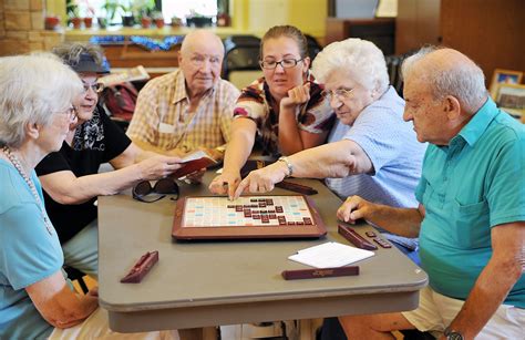 Indoor Group Activities for Seniors Promote Socialization. Seniors playing scrabble - Activities ...