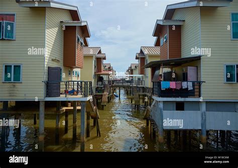 Modern houses are part of the water stilt village Kampong Ayer in ...