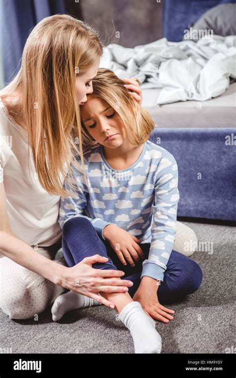 Mother hugging sad daughter Stock Photo - Alamy