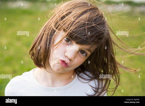 Portrait of little girl pouting Stock Photo - Alamy