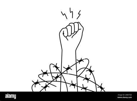 Close-up of hand in fist in wires thrive for independence and freedom. Raised hand with clenched ...