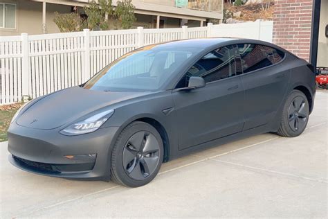 Matte black Tesla Model 3, stunning photos, wrap cost and info