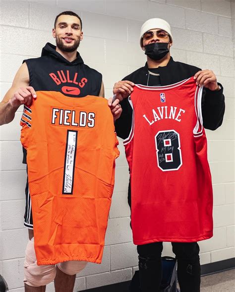 Bears QB Justin Fields swaps jerseys with Zach LaVine and DeMar DeRozan Photo Gallery | NBA.com