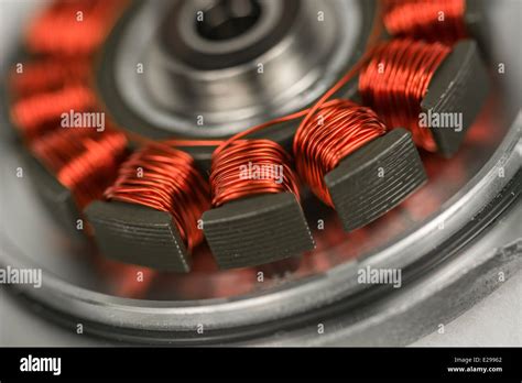 Macro photo of HDD / hard disk drive spindle motor with exposed copper stator coils. See ...