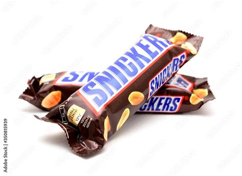 Snickers candy bar on white Stock Photo | Adobe Stock