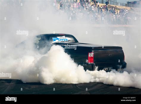 Australian Holden utility (ute) performing a massive burnout at an Australian car lifestyle show ...