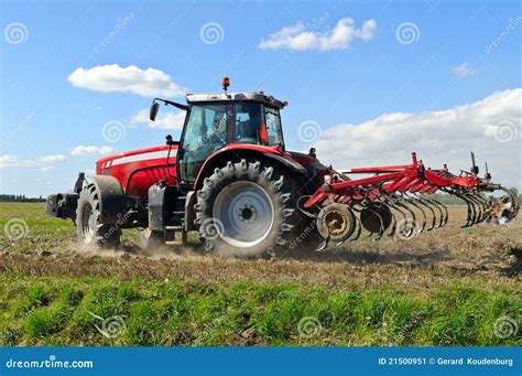 Farm Tractor Plowing The Land Stock Image - Image: 21500951