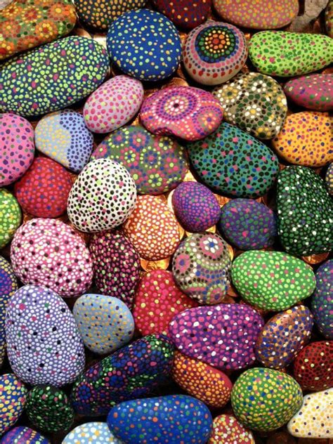 many different colored rocks with dots on them