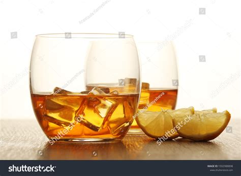 Two Glasses Whiskey Ice Cubes Stock Photo 1592988898 | Shutterstock