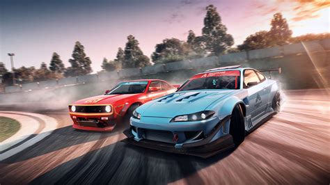 Download Two Cars Are Racing On A Track Wallpaper | Wallpapers.com