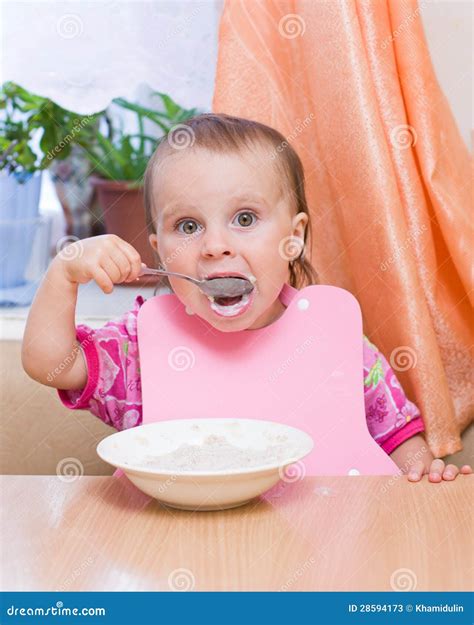 Little kid eating cereal stock image. Image of adorable - 28594173