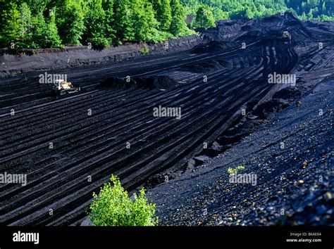 LARGE BULLDOZER MINING A 'DAM' OF ANTHRACITE (HARD) COAL (OPEN PIT OR ...