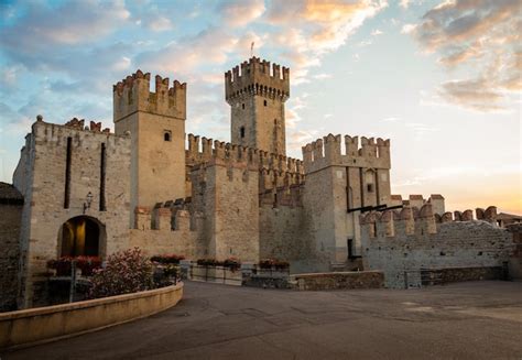 Premium Photo | Sirmione italy castle on garda lake scenic mediaeval building on the water