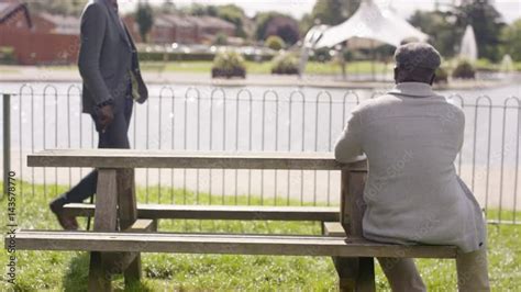 Sad senior man sitting in park alone with his thoughts Stock Video ...