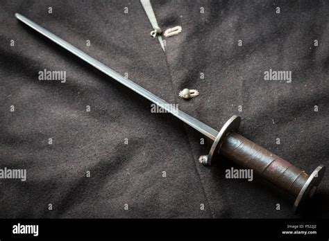 Man at arms, medieval rondel dagger and jacket Stock Photo - Alamy