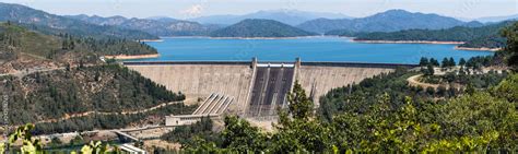 Panoramic view of Shasta Dam on a sunny day, Shasta mountain visible in the background; Northern ...