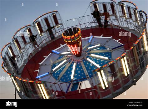 Spinning Round-Up Amusement Ride at Night Stock Photo - Alamy