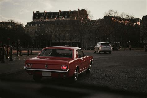 A Red Vintage Car on the Road · Free Stock Photo