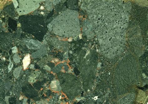 Polymict conglomerate (5.7 cm across) having komatiite pebble (lower right)from the Timiskaming ...