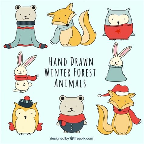 Hand drawn animal set wearing winter clothes | Free Vector