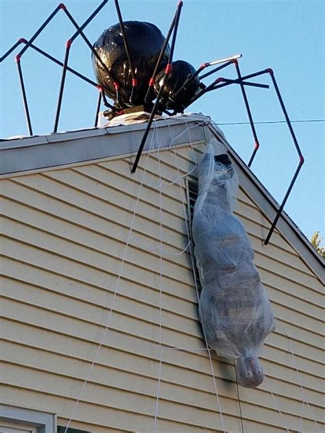 Giant spider and webbed victim | Halloween spider decorations, Halloween outdoor decorations ...