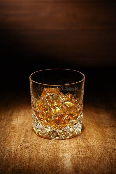 A Spotlight on a Single Crystal Glass of Scotch Whisky, Shot on Stock Photo - Image of closeup ...