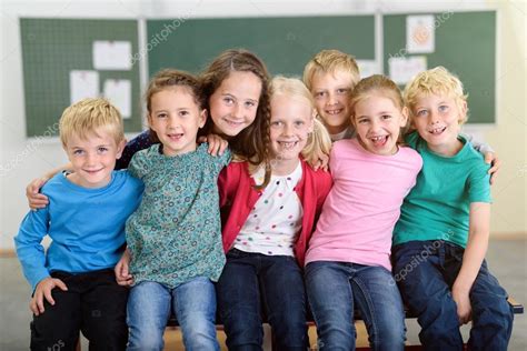 Happy Kids Inside the Classroom Smiling at Camera Stock Photo by ...