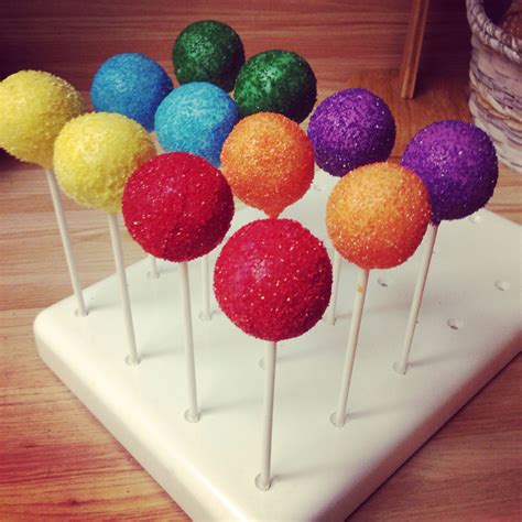 Rainbow cake pops | Rainbow cake pops, Honeybee cake, Rainbow cake