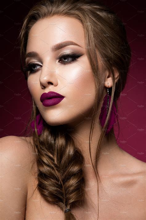 Make up. Glamour portrait of beautiful woman model with fresh makeup and romantic hairstyle ...