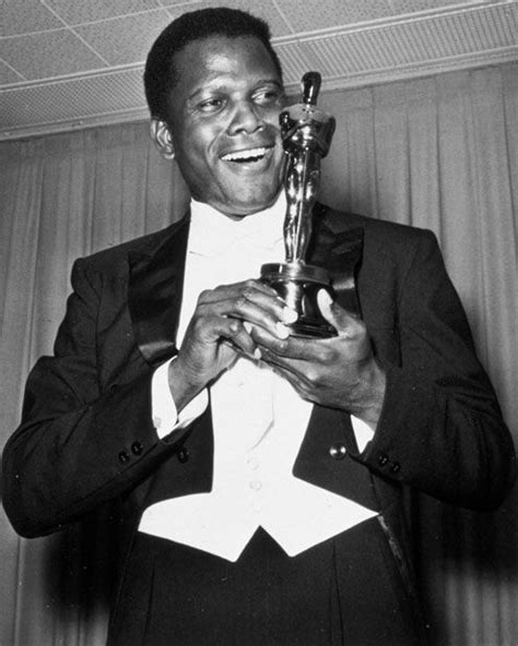 1964: Sidney Poitier smiles as he poses with his Best Actor Oscar for ...