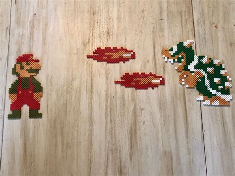 Mario Bros Bowser and Mario boss fight, retro pixel art, perler bead magnets, Mario, Bowser ...