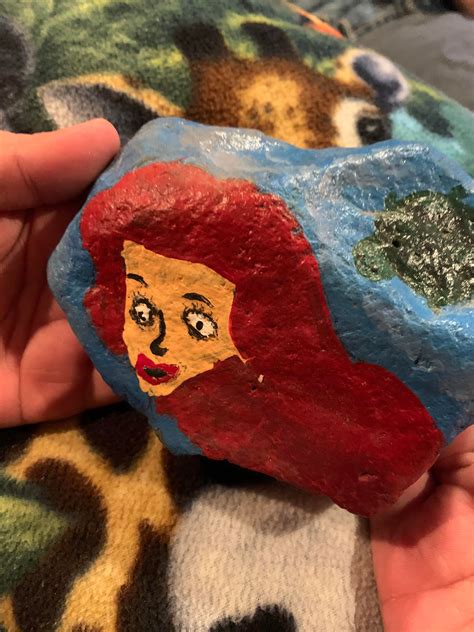 My friend’s niece tried to paint Ariel on a rock but I think it looks ...