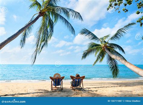 Couple Relax on the Beach Enjoying Beautiful Sea on the Tropical Island Stock Image - Image of ...