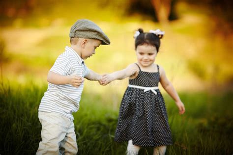 Boy Holding Girl's Hand Royalty Free Stock Images - Image: 28918359